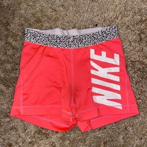 Neon pink Nike shorts